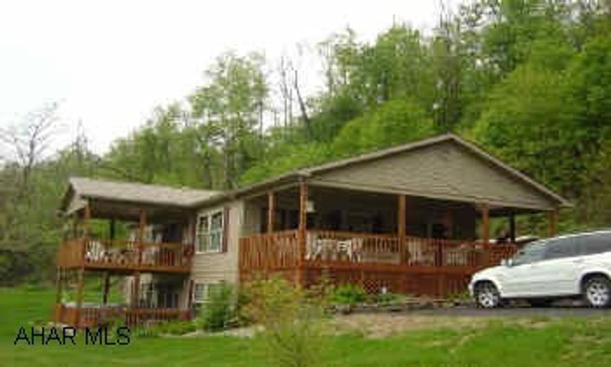 Owner stipulates she will not sell to anyone planning to use ASA dog kennel. Property will be sub divided approx 4-acres with home. Beautiful Pond.  Secluded rancher family room with fireplace, eat in kitchen, great room, 1st floor laundry, 3 bedrooms, 3 bathrooms 3 covered decks. Mint condition.