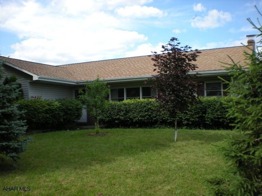 Internal garage is approx 13'6 x 36'4 This spacious home features 3 bedrooms, 2 1/2 baths, finished basement, internal 1-car garage and an enclosed sunroom.  Newly remodeled kitchen, flooring, roof and wood pellet stove are just some of the upgrades.  Enjoy beautiful country-side views from this well maintained ranch home on a 1-Acre lot just minutes from town.  Public water and sewer will be connected within 90 days at seller expense.  This home is a must see!