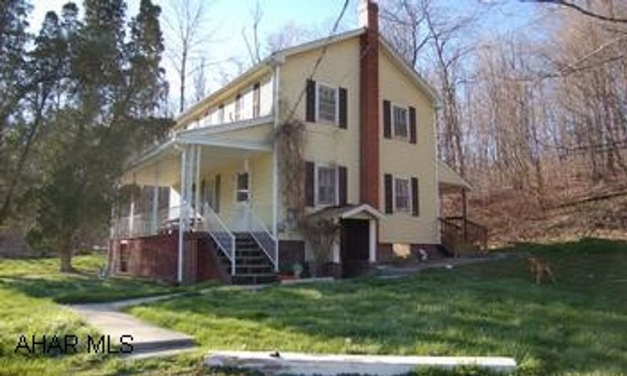 2 Story, 3BR, 1BA, wooded, stream, hill & flat, spring on property. 2 story 3BR, 1BA, washer dryer hook-ups on first floor, front and back porches, vinyl, siding, newer roof, 4.876 acres, wooded, stream, hill & flat, spring on property, land perked in past, motivated seller, property has great potential. SOLD AS IS. Good well, Septic is a holding tank has no leach bed. Property has two tax ID numbers please find 2nd ID#  in the legal description.