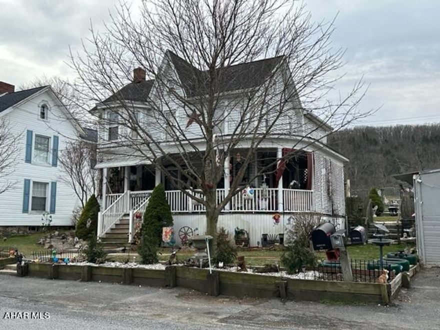 Spacious 2 story Victorian farm house with wrap around front porch.   Detached 2 car garage with fenced back yard.   3 bed, 2 full bath, central AC, updated flooring, electrical, kitchen, baths and more.