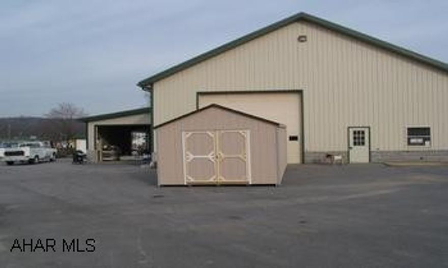 First class 4,368 sqaure feet multi-purpose, steel building built in 2003. Fully insulated with forced air heat and a/c. Drive-in, concrete floor. 3 large overhead electric doors with 22' inside clear span sloping to 15'. Property is 3/4 of an acre, with over 10,000 sqaure feet of paved parking. Two private offices and employee break room, 200 amp electric, with public water and sewer. Convenient to I-99 and Routes 220 and 22. Call Art Wilkin 330-8670 for exclusions.
