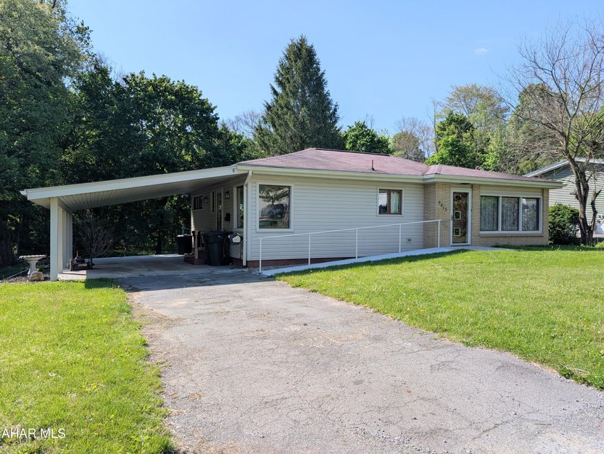 Move-in ready single-story ranch living with a carport! RAMP ACCESSIBLE front entrance. Enjoy the lovely backyard on nearly 0.40 acres- open grassy space just off the carport, with beautiful mature trees providing shade across the back half of the yard. Huge winodws in the living room let in lots of natural light. There are refinished hardwood floors throughout and a fully updated kitchen. This home has a Natural Gas Central Air and Heating system, walk-in shower, and convenient first-floor laundry. Major maintenance and updates have already been completed, offering peace of mind and true move-in ready comfort!