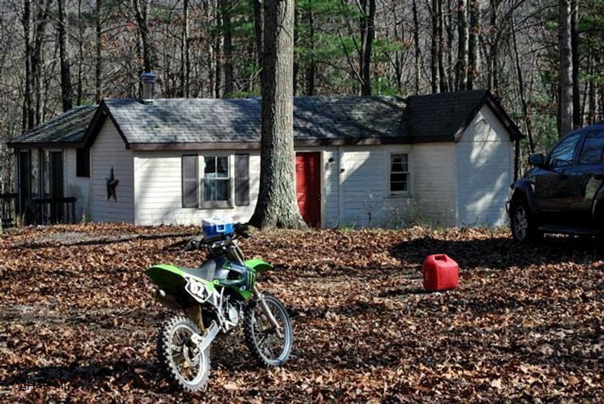 Wonderful, recreational cabin on 15 acres with Buchanan State Forest right across the road. This property is a hunter's paradise or just a super family retreat. The cabin has 1 bedroom, 1 bathroom, kitchen and beautiful sunroom, woodstove and deck. Water, septic and electricity are at hand! The property is awesome - has several streams, very usable woods, four wheel trails, and close to 1000 feet of road frontage.