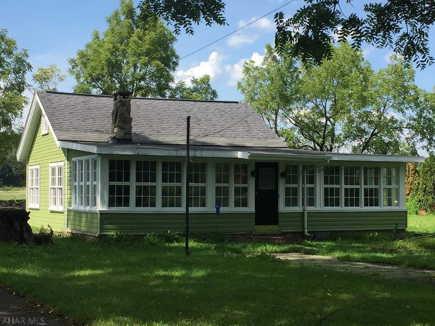 3-bedroom cottage on a double level lot with 2 full bath, sun room, 3-fireplaces, new kitchen counter tile and painted cabinets, flooring & some replacement windows, private well and public sewer. Easy access to all amenities, Shawnee State Park, Blue Knob Resort and State Forest.