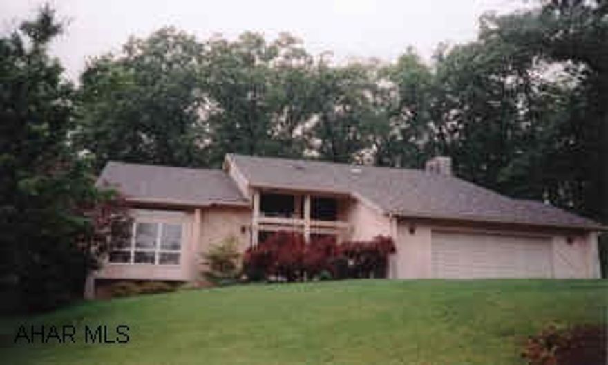 CONTEMPORARY HOME LOCATED ON A BEAUTIFUL WOODED LOT IN ELMWOOD. MASTER SUITE WITH JACUZZI, SKYLIGHT AND SEP. SHOWER.  SPACIOUS SUNKEN FAMILY ROOM WITH GAS FIREPLACE.