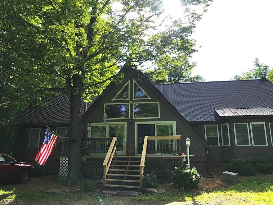 Your expansive forest getaway awaits! A hunter and fisherman's paradise. Fish from your own backyard in the creek! Over 10 acres of lush green privacy. A-frame home has a unique story-book feel with it's vaulted ceilings, walls of windows and fun lofts. No lack of space or storage. 4 bedrooms, 2.5 baths, sprawling open concept kitchen and dining room with floor to ceiling stone propane fireplace. Huge open entertaining space in the living room with amazing natural light from the upstairs skylights and towering windows. Master bedroom has en-suite full bath, walk-in closet and a large loft over-head featuring a fun rolling ladder as an additional access point! Three decks and enclosed gazebo outside. Perfect for a getaway from the city or safety and privacy for your growing family.