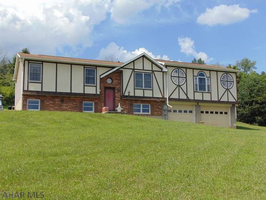 Large home on 30 acres in Turkey Valley. 3 Bedrooms, 1.5 baths, Great Room with large windows to enjoy the view. Hard Wood Floors through out the main level. Kitchen is eat-in. Lower level has bedroom/family room, laundry and plenty of storage. The 2 car garage is oversized and room for all kinds of "toys". If you like privacy and a view this is for you. Acreage is behind the house. Levels off at top of mountain...used for shooting and recreation. Large storage building is included.