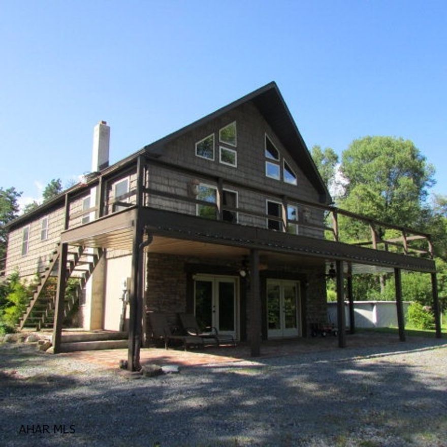 A rare find - unique contemporary home on 40 acres w/wrap-around deck on 3 sides w/patios underneath. An above ground pool. Very private setting; many wildlife sightings. Main level has bamboo flooring throughout & an open floor plan at LR, DR & Kitchen. Nice lighting. Ceiling is vaulted with T&G pine. Two sliding doors give access to front deck w/views. Eat-in kitchen has bar area, SS appliances included, pot rack @ island; granite c-top. Large Master BR & 3/4 bath w/access to back deck. Laundry w/chute from 2nd floor. 2nd floor has walkway to loft, large bedroom & 3/4 bath. Lower level has partially finished kitchen & bath w/unfinished 18x16 FR w/Harman wood stove. 3 heat systems-outside furnace, oil, or heat pump. Large 60x30 pole-building garage w/loft, 2 tall doors-possible business.