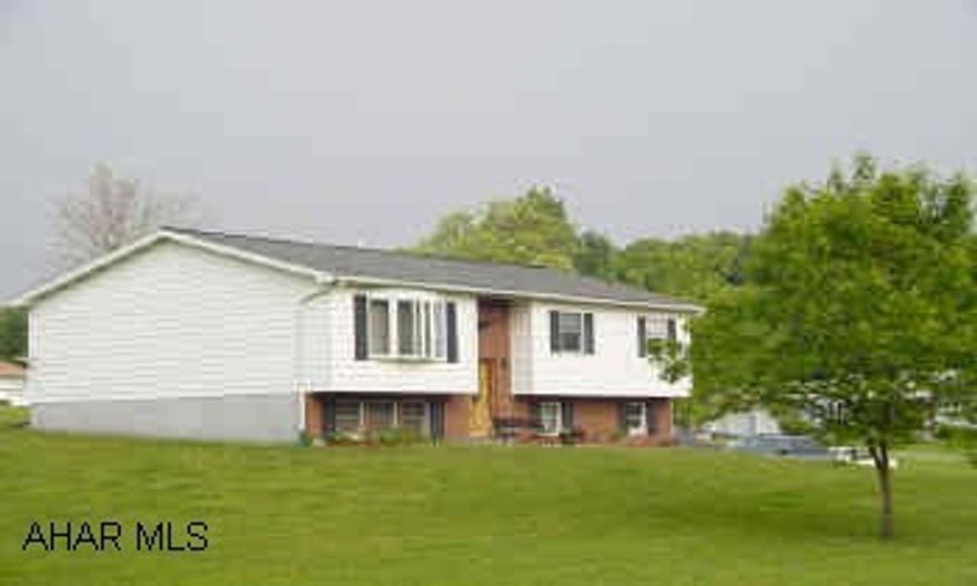 Newer hardwood floors, carpeting, tile.  Mahogany door, french door, oak trim.  Two heating systems, oil hot air and electric. Electric dog fence around perimeter of property. 1.13 Acres, Rural setting.  Many updates within last several years.   Must see this country three bedroom, 1 3/4 bath, two car integral garage.  Updates include hardwood floors, carpeting, tile, family room, baths, new heating system, mahogany front door, oak trim, french door off of dining area.  Two heating systems: oil hot air and electric.