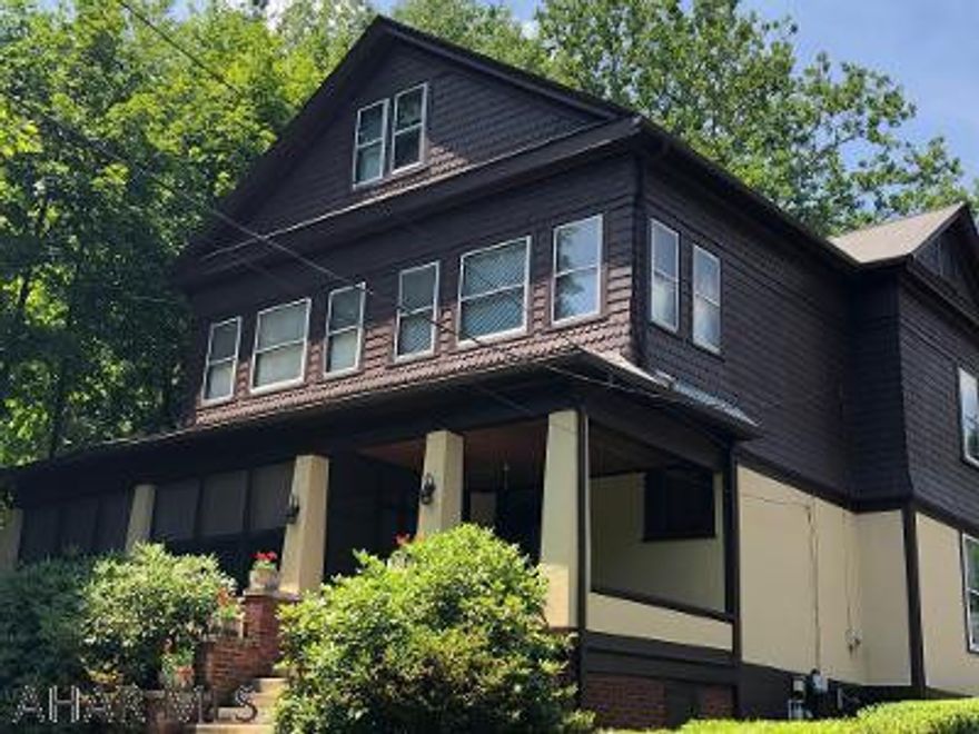 This magnificent Craftsman Architectural Style Home sits on a large lot on a quiet street.  The original character of the home has been left untouched.  Beautiful original hardwood floors throughout most of the first floor.  The rooms are large and offer plenty of natural light.  You will love the kitchen with its retro style and feel.  There is also a large family room with a wood fireplace for cozy winter nights.  Laundry and half bath complete the first floor.  Second floor has 3 bedroom 2 baths and an office/4th bedroom.  This floor is also filled with natural light for a bright and cheery atmosphere.  2 Car detached garage.  Quiet and private lot.  Don't miss the huge screened in wrap around porch...its awesome. For the buyer who appreciates the timelessness from an era gone by.