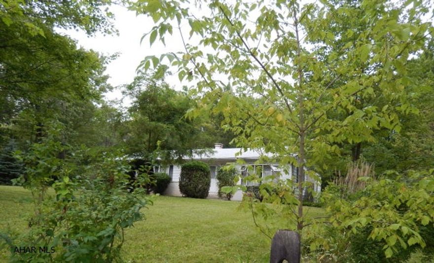 Sold AS IS. Needs extensive work. On a beautiful 1/2 acre lot .... Private wooded setting.  Can connect to city sewer.