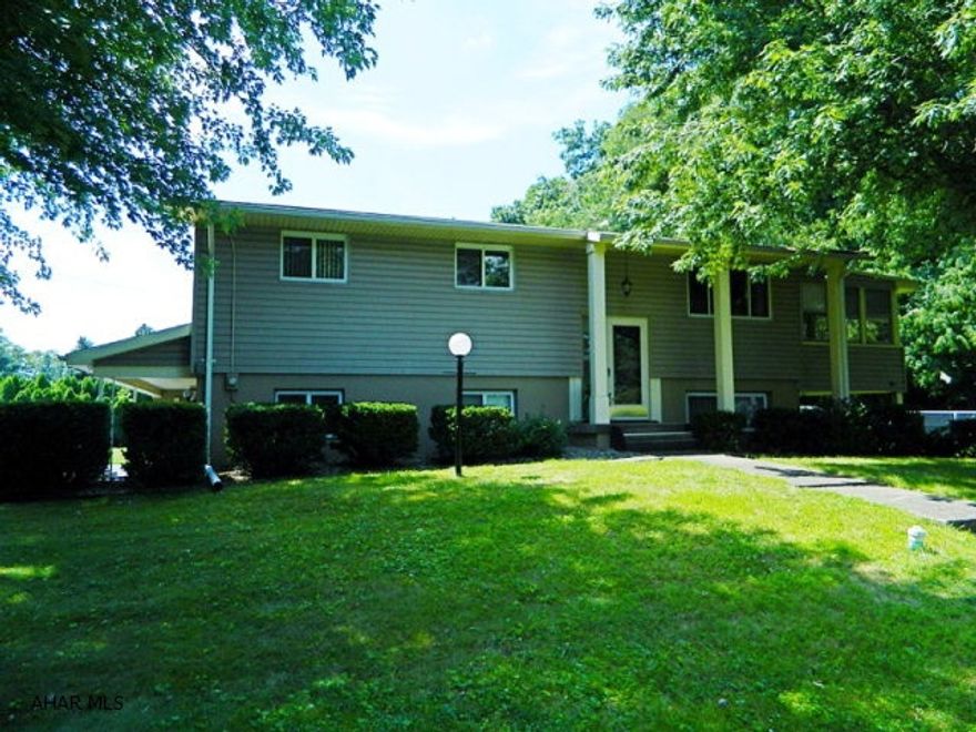 Well cared for split level larger then it looks, 3 BR, 1 full bath, 2 half baths. Basement is finished with FR with a fireplace, craft room, laundry room. New kitchen and main bath. Huge 2 car attached garage and a nice screened in porch. Lovely flat yard with tons of room to play ball, or have a camp fire. Very private too with woods in the back. Don't just drive by.