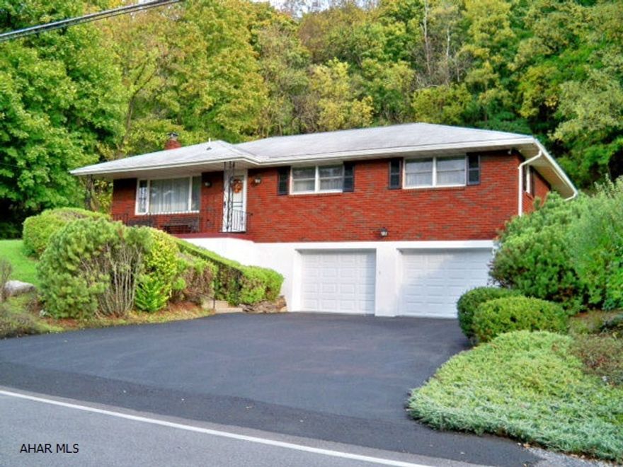 Welcome to this carefully maintained brick raised ranch. Located just beyond Hollidaysburg Borough, a great location. Large living room open to Dining Room with sliding glass doors to patio & fenced yard. Yard extends beyond fence totaling .8333 acre  with a wooded back drop. Enjoy nature from the comfort of your patio. This home offers finished basement with fireplace and bar. Large 2 car garage.