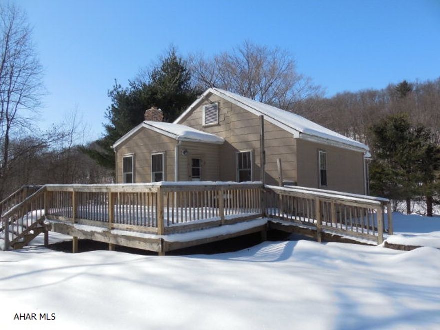 Country living in this nice 2 bedroom 1 bath home on 1.2 acres. Home has newer kitchen and bath updates and is rewired with 200 amp service, a large deck for entertaining, big yard and lots of trees.  Enjoy the great outdoors in peace and quiet!