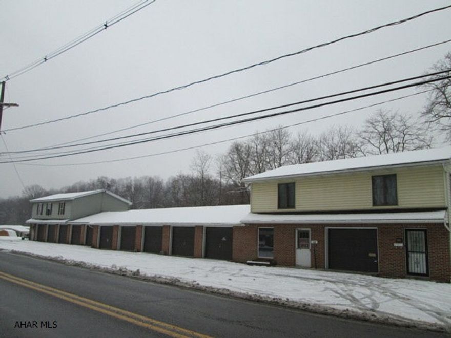 Great money maker in Antis Twsp. Two residential units with 2 bedrooms, bath, living room and 1 car garage. Nine garages and 1 vacant store front. The sale includes 2 water taps for future buildings.