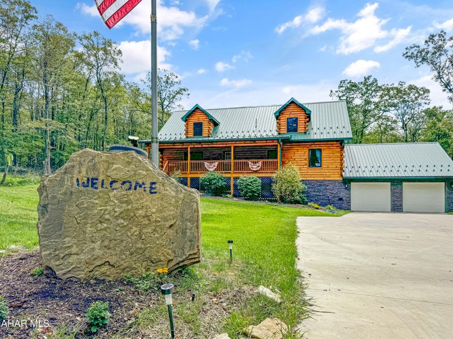 ***MOTIVATED SELLER*** Seller is open to selling the house w/ 10-12 acres for $549k. Reach out for further details. Introducing a stunning custom Timber frame log home built in 2019, nestled on approximately 44 acres of mixed flat and rolling land with mature hardwoods, offering privacy & a secluded experience every day. Nearest neighbor is ½ mile away & surrounded by lush woods, Yet only 10-15 minutes away from Windber, Alum Bank, or Carinbrook.  this property is a dream come true for hunters, hikers & or outdoor enthusiasts alike. Nearby access to Blue Knob Ski Resort, great fishing in the Clear Shade Creek, & the township allows quads, UTV's snowmobiles, etc. on the roads! As you step into the rustic enchanted main floor, you'll be greeted by soaring 20-foot vaulted ceilings that create an inviting & spacious atmosphere. The beautiful living area flows seamlessly into a generous kitchen featuring an island, perfect for entertaining. This level also includes a full bathroom w/ convenient 1st floor laundry & 2 ample bedrooms. Ascend to the upstairs loft, currently utilized as the master suite, where you'll find your own private full bathroom. The fully finished basement offers additional living space, complete w/ another bedroom & half bath, a utility room, & a 2 car attached garage. The exterior of this remarkable home is simply breathtaking. It boasts abundant parking for guests, a 20x20 detached two car garage, a 12x10 shed, with lean to & a large cleared yard, all complemented by a wrap-around covered porch that invites you to relax & enjoy the serene surroundings of nature. There's so much more to discover that it's impossible to list everything! Call today for more information, & remember, a scheduled tour is required to access the property at all times.