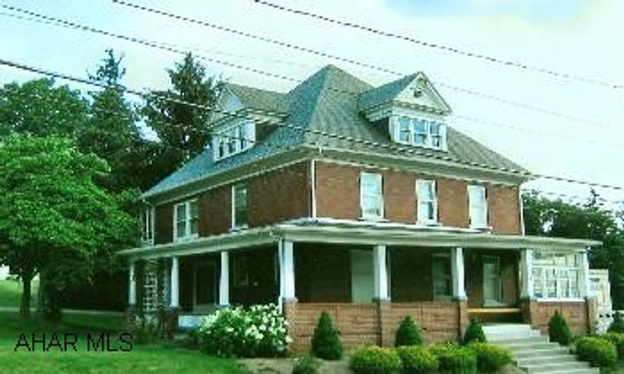 Lovely 3-Story Brick Home with wraparound porch, detached 4-car garage with an upstairs that could have many uses. Pocket doors, hardwood floors. Zoned Commercial /  Residential.