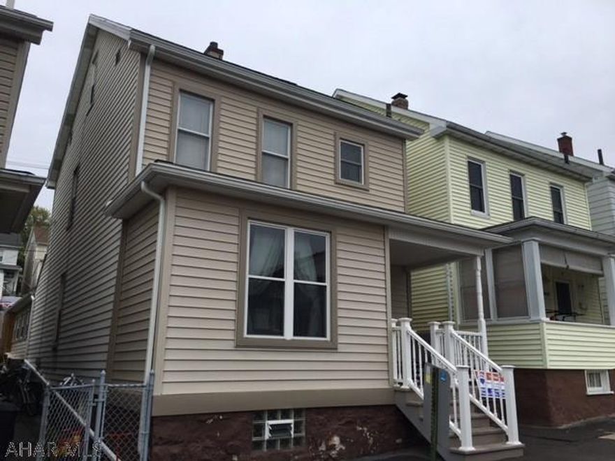 Great home in great neighborhood. This home has been updated from top to bottom. All mechanics...roof, windows, furnace and AC...done. New flooring and trim. Newly redone bath on second floor. 3 Nice sized bedrooms. Attic is finished and heated. Could be 4th bedroom. Family Room (with stove and grill) and new bath added. Doors from the family room open to an enclosed and private back patio. The Hot Tub stays! One car detached garage. Concrete pad for 2 off street parking spaces. So much more. Nothing to do...move right in!