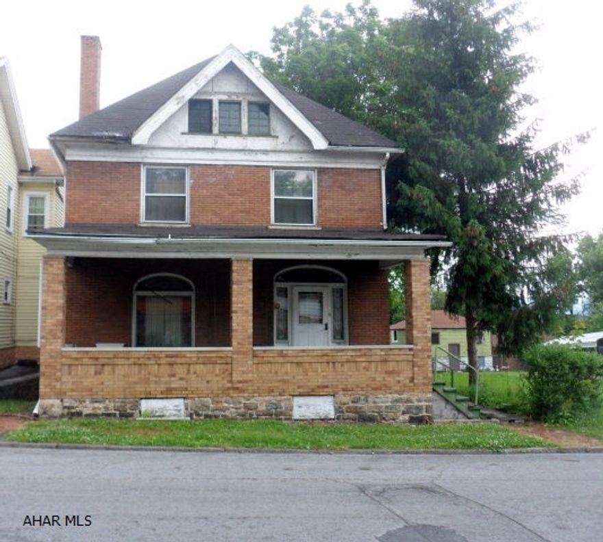 Turn of the century home with beautiful original woodwork and hardwood floors, 4-plus bedrooms and 2.5 baths. Original beveled glass around front entrance with stained glass stairway windows. This home is 3 story with front and rear staircase. Living room with fireplace, pocket doors, and new carpet, dining room with built in china closet, eat-in kitchen, bath & separate toilet room, and den or 1st floor bedroom. Level 2 has 4 bedrooms and bath. Level 3 has 3 rooms plus storage area. Natural light fills the entire house. There is ample storage, 1-car/2-story garage, lot 43x120 irr. ****Slate roof and front porch needs repaired, orginal cement porch steps under wood. Would make a great duplex. (Take flashlight to find switches.)