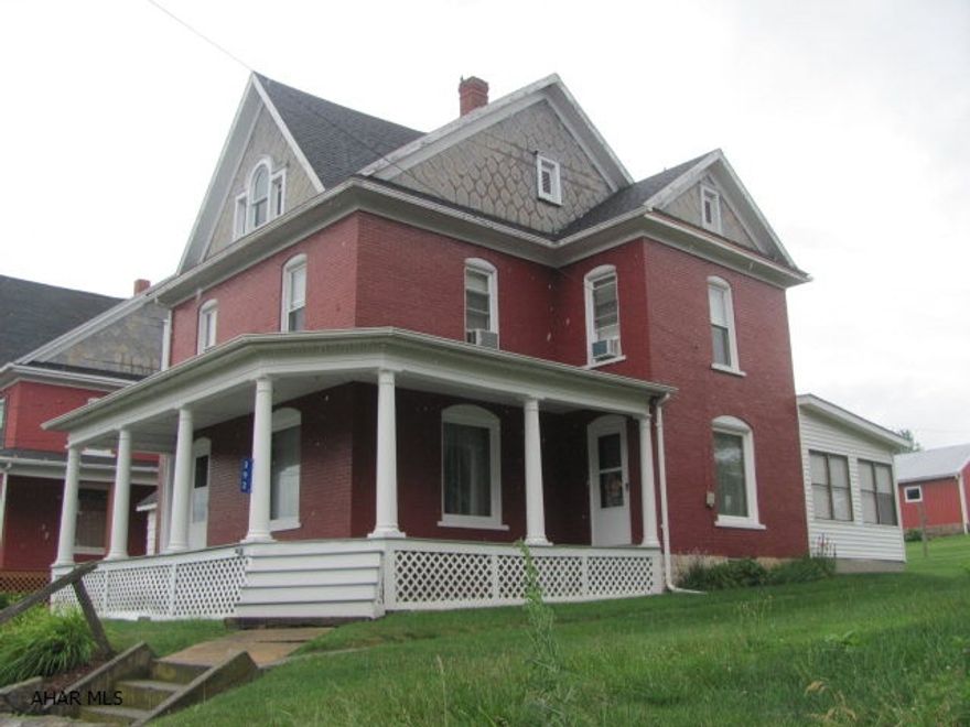 Stately 2 story, well maintained brick home in New Enterprise. First floor with 3 season room and large kitchen. Original wood work and hardwood floors. Second floor with 3 bedrooms and bath. Large back yard with detached 1 car garage/workshop that is easily access from rear alley. This home has been very well maintained and is move in ready!