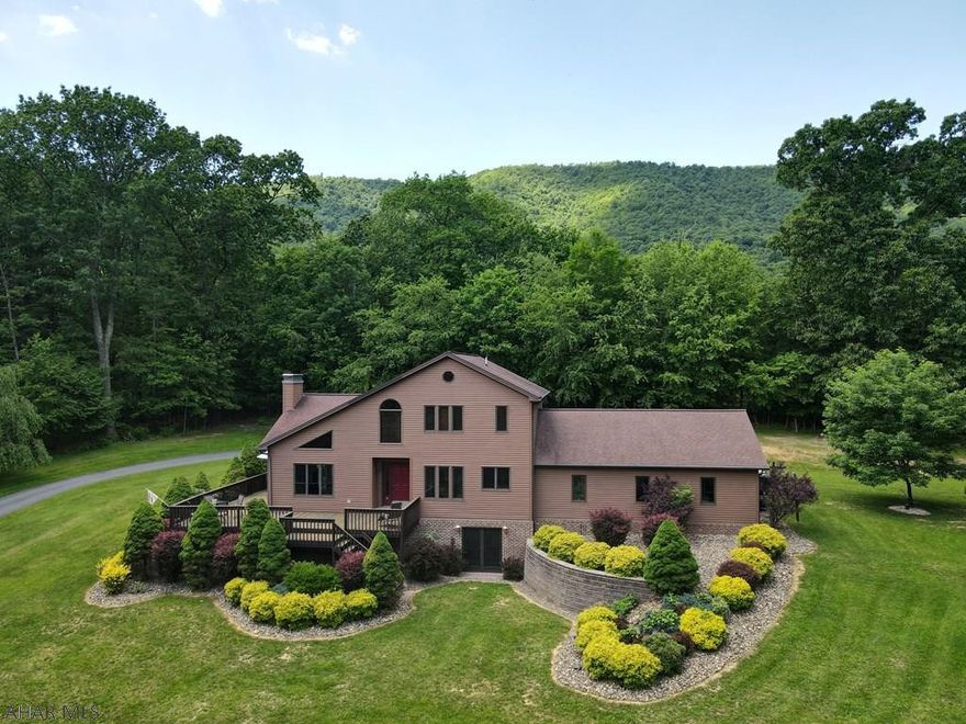 Rare Gem nestled in the woods of the Alleghany Mountains in meticulous condition. From the moment you arrive, the extremely energy efficient home embraces you with its warmth and charm in its delightful setting. Nature just seems to flow seamlessly from interior and exterior spaces and will impress friends and family as you entertain in the airy and open concept design. A conveniently located first floor home office could easily be converted to a master suite which is adjacent to full bath and laundry room.  No expense was spared in the newly renovated lower level family room and could also be used as a guest retreat.  The charming historic town of Bedford, the world class resort of Omni Bedford Springs and State Game Lands are minutes away.  Wow!