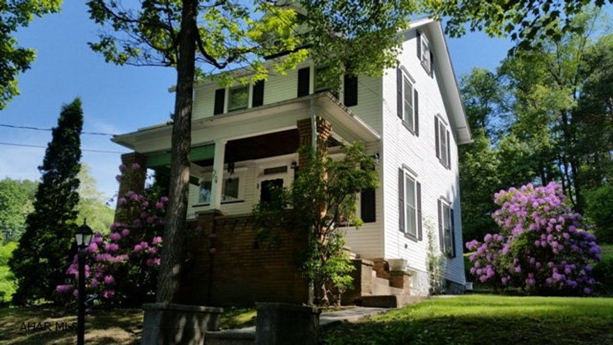 Exceptional Tyrone 2 1/2 Story Home. Spacious .58 acre lot, front and rear porches. Eat-in Kitchen area, large living room. Great matured setting with room for a garden.  This family home will not last long