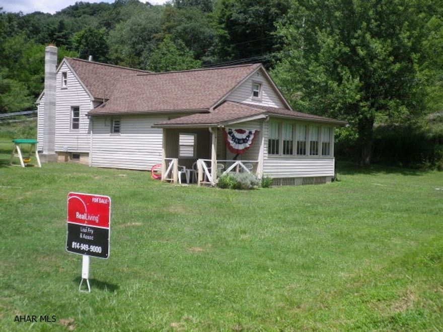 Cute starter home outside the city, but close to all amenities.  Hardwood floors under carpet in the living room & master bedroom.  Newer furnace.  Septic tank cleaned approximately 2 years ago.  Water softener is rented.  Needs some TLC.