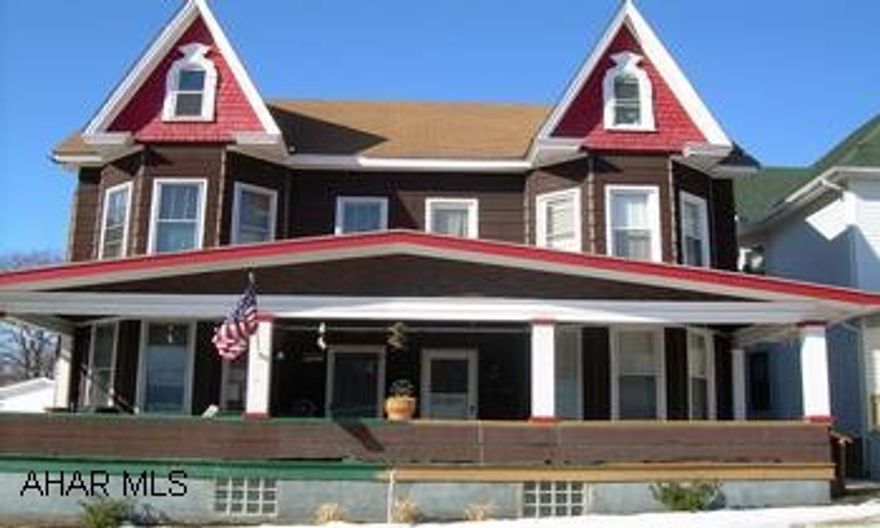 2 story double house. Owner side completely remodeled, new wiring, kitchen, bath, doors, windows, newer carpet, first floor laundry, and separate utilities.  Owner side  contains forced air heat, tentant side contains hot water heat.  Live on one side and have tenant pay most of the mortgage or use as a great investment property.