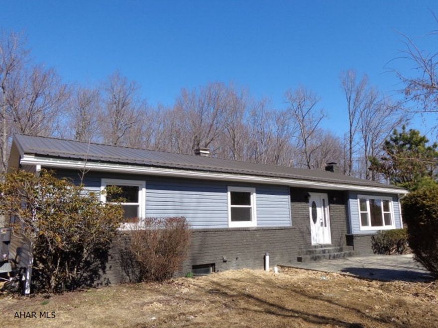 Sensational remodeled 1 story home near Penn State Altoona Campus. Private wooded setting on a 1/2 acre lot. Gorgeous new kitchen with an abundance of cabinets and countertop. New hardwood and ceramic tile floors. Stainless steel appliances included. Seller recently connected onto Logan Twp public sewer. New roof, heat pump with central air, hot water tank, siding and windows. The spacious unfinished basement with stone fireplace could be easily finished. Come see for yourself! Basement will be waterproofed by June 30th, with a waterproofing guarantee.