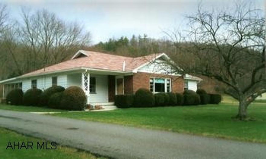 Cozy brick/aluminum ranch home well kept and well built. Home has lovely features, hardwood under carpets, birch cabinets in the kitchen, built in cabinet in the dining area. Woodstove insert in living room for added warmth. Full basement with laundry room has walk-out access. Also large rec room and a finished family room with a wood fireplace. Oil hot water furnace installed in 1997, roof replaced in 2003. Outside has an inviting rear covered flagstone patio, detached 2-car garage and paved driveway. Front view is of the stocked Yellow Creek Stream and from the back its just yards from the property to State Game Lands.