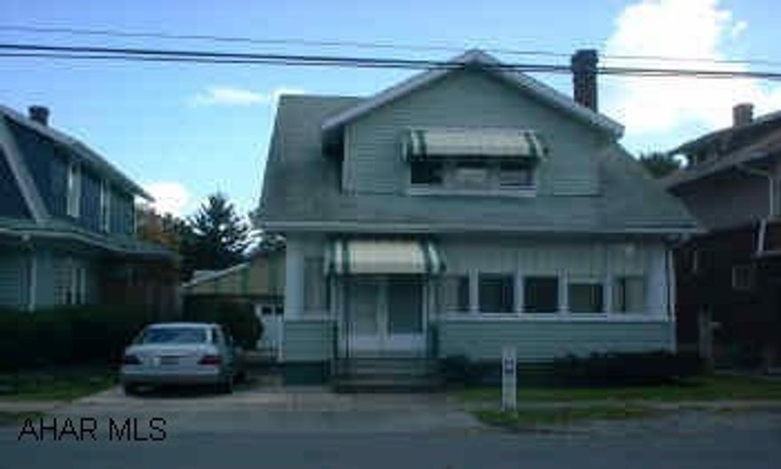 2.5 STORY WITH 3 BEDROOMS, 1.5 BATHS. LARGE ROOMS. 1 CAR GARAGE.  THIS 3 BEDROOM, 2.5 STORY IN A PRESTIGIOUS AREA WITH A ONE CAR DETACHED GARAGE, LARGE LIVING ROOM WITH BRICK FIREPLACE, SUN PORCH, HARDWOOD FLOORS. UPDATED WIRING AND 1.5 BATHS.