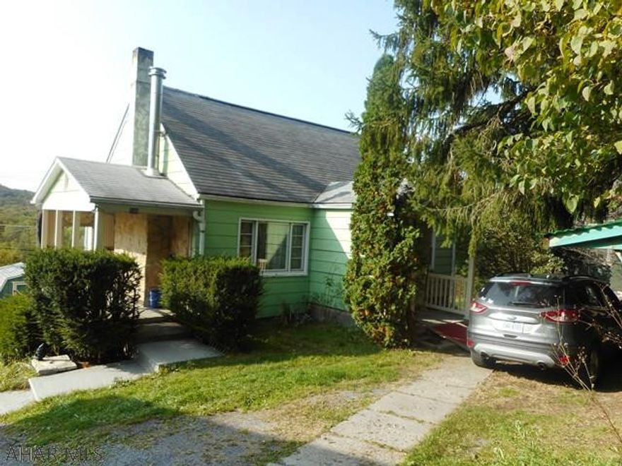 Nice 1.5 story home 4 bedroom home with family room addition, fireplace in living room, spiral stairway to second floor. UV lite on well. Most windows replaced. Hilly lot with parking on 53.  Lots of house for the $$.