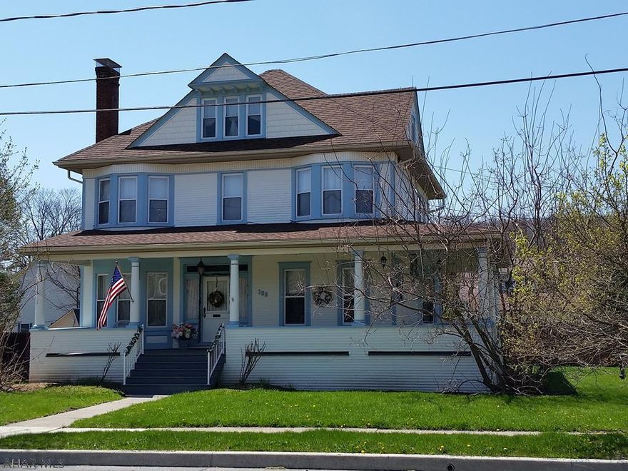 2.5 story Victorian w/freshly painted exterior in 2017; new dormers, gutters & roof on home & porch 2013; mostly vinyl windows, nice wraparound porch, Eat-in Kitchen w/counter bar, 1st-floor Family Room w/bay window, Formal Dining Room with/gas fireplace & pocket doors, Living Room w/woodburning fireplace, 4 Bedrooms (master has electric decorative fireplace), Full bath w/jetted tub on 1st floor plus updated bath on 2nd floor. Laundry conveniently located on 2nd floor. Beautiful hardwood floors. 1-car detached garage & back deck. J-433
