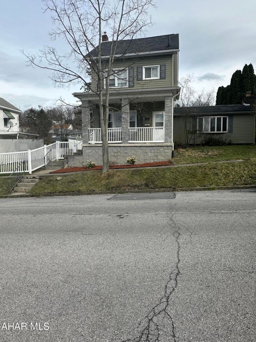 Don't wait to schedule  a showing on this spacious Fairview home with 3-4 bedrooms and 1.5 baths situated on a spacious 75x120 completely fenced in yard. Beautiful 21x21 family room addition with a brick fireplace & bar area. Finished attic with heat could be 4th bedroom. 2 car detached garage. Nice covered patio area in the back and a cozy covered front porch with beautiful views!  Lots of room in the yard for the kids and pets to play.