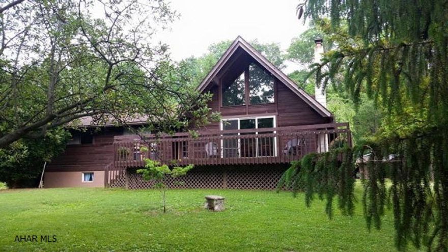 MOTIVATED SELLER! Beautiful cedar home, in Spring Cove school district! If you are looking for a secluded living space this is it. Sellers have made too many updates to list including, hardwood flooring, ceramic tiles, travertine countertops, stainless steal appliances, and new heat pump! Part of the property is fenced in for horses. Finished basement would be perfect for an in law suite. Property features a barn for smaller animals a summer kitchen with gas and electric, and 2 story play house.  This house definitely is worth a look. Wooded acreage is able to be Timbered, seller has some quotes on hand. Call today for your showing.