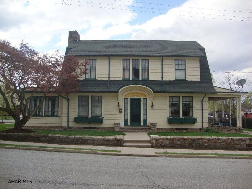 Terrific 4 bedroom borough home on corner lot with a 3 car garage. Original stone fireplace in living room. Updated eat in kitchen, hardwood floors, new bathroom, pretty sunroom. Terrific location. Walking distance to grocery store, the Diamond, schools, YMCA and Sheetz.