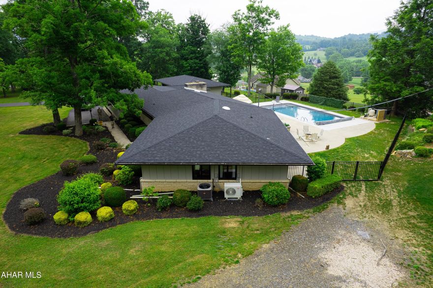 This striking  Mid-Century home has been totally renovated where no detail has been overlooked and even the most discriminating buyer will appreciate its transformation.  The curb appeal is captivating and people will definitely be drawn to its stunning setting and design.   A very wide, low footprint with large open spaces and floor to ceiling windows allow indoor and outdoor spaces to blend seamlessly creating a zen like feeling in this spectacular modern retreat.    Entertaining guest and family in the outdoor oasis  with new heated pool and huge outdoor patio surrounded by gorgeous vistas and new black aluminum fencing is simply delightful.  The home is stunning!  The comfort in knowing that this home's updates include new HVAC, new roof, new flooring, new bathrooms, new kitchens, new fencing, new bedrooms, new walk in closets, new chimney and roof flashings, new appliances, new exterior and interior paint, new lighting and so much more make this home a tremendous value.  Add the four car garage and 2.5 acres and its no wonder that this home will not last long!