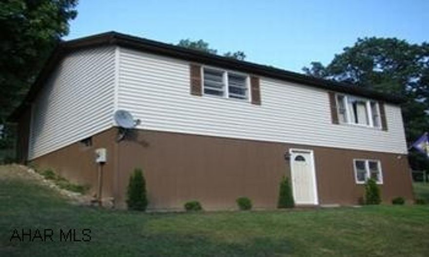 2 bedroom possible 3rd bedroom in basement, horse barn, 10 acre property. Newer roof, possible 3rd bedroom in basement, finished basement with Nester Martin stove in basement. Horse Barn.