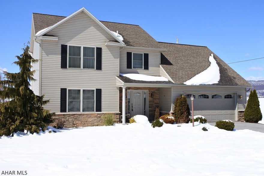 Very well maintained 2 story just outside of town.  Public water and sewer, nice views. House features a large LR plus a first floor FR with fireplace....sliding doors to a rear deck.  Spacious kitchen with lots of storage, 2 tier island for seating...all appliances stay.  Hardwood  and ceramic tile floors.  Nice sized bedrooms...full, tall basement just ready to be finished.  Move right in!!