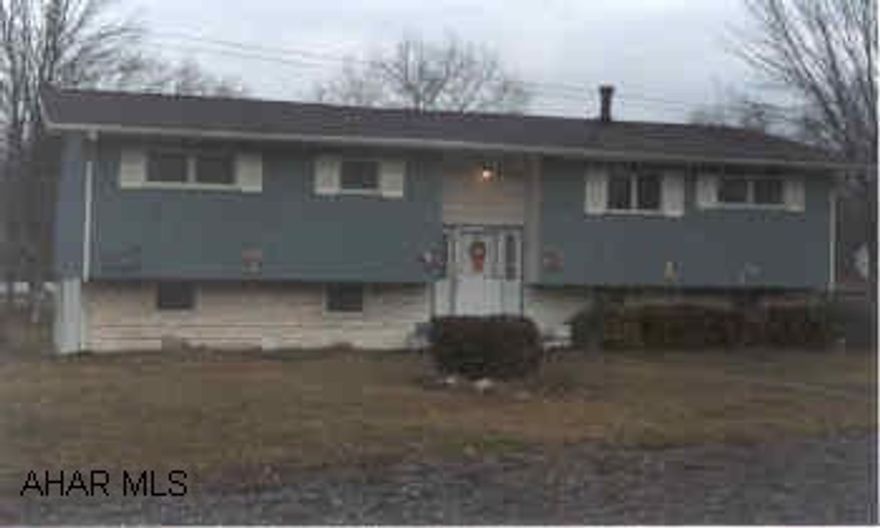 Nice yard, bi-level on large corner lot.  Large deck above ground pool, needs cosmetics.