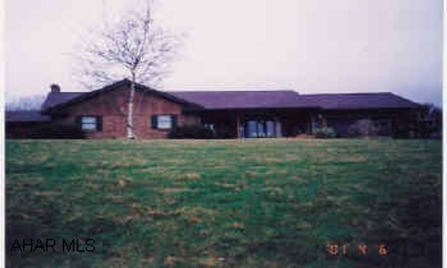 This house has it all. Conveniently located, landscaped, in ground pool, 5 spaces for cars in garages.Well kept.