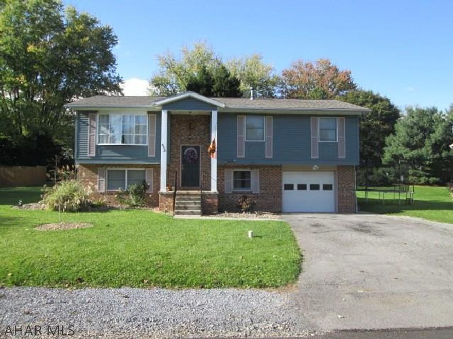 Fabulous bi-level that has so much to offer! Kitchen features a breakfast bar, stainless steel appliances, and plenty of cabinet space. Semi open floor plan from kitchen to dining room. Spacious living room with beautiful laminate flooring. Master bedroom has a 3/4 bath. Newly remodeled full bath on main floor. Lovely sun room that overlooks a peaceful yard and a refreshing swimming pool. Gigantic family room in the finished basement. Newer roof, off-street parking, and  a 1 car garage. This spectacular property is a homeowners dream!