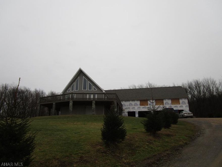 Fabulous home with a million dollar view on 5 acres!  Built in 2015 this modular home boasts a large living room with gas fireplace and vaulted ceiling, open kitchen dining area, large master bedroom with bath and large walk in closet. Loft area for 3rd bedroom, if needed or large rec room. The home has a framed in  30x60 addition with basement area and 3 car garage (unfinished). In addition there is a pole garage measuring 40x60 with heat,16' ceiling, insulated and plumbed for air and water. Truly a remarkable home for the $$ with asking price well under cost incurred.