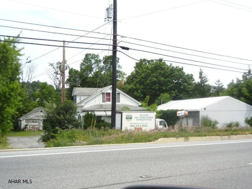 Prime Commercial location in high traffic area.  Garage and 40x60 pole barn.