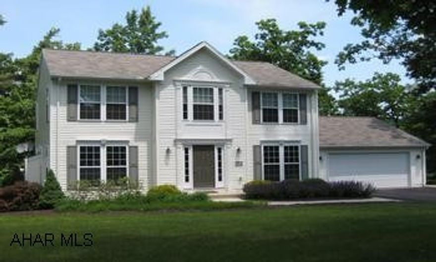 Beautiful Centre Hall Colonial on private wooded 1.81 acre lot. De Haas Builders- New in 2003-1 owner. Like New. Beautiful setting. Crown Moulding Tray Ceilings and Chair Rail in Dining Room. Oak Hardwood Foyer. Gas Fireplace in Family Room. Heat Pump. Bills range from $70.00 in summer to $300 in winter.  Floor to Ceiling Windows.  Ideal Location 20 min. to both Altoona and State College.
