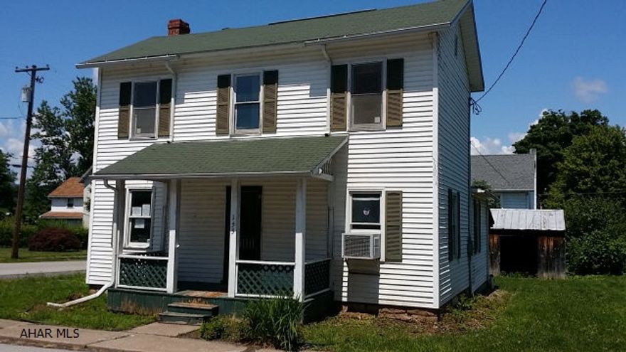 Two story vinyl in quiet neighborhood.  Updated eat-in-kitchen, large living room and formal dining room, large covered rear patio, first floor laundry.  Needs some TLC, but could be your perfect home.  Property sold AS-IS. Seller will make no repairs. Buyer pays both transfer taxes. Equal Housing Opportunity. Property is uninsurable with $2,000 worth of MPR items. The reason it is not insurable is because its' remaining economic life is 10 years.