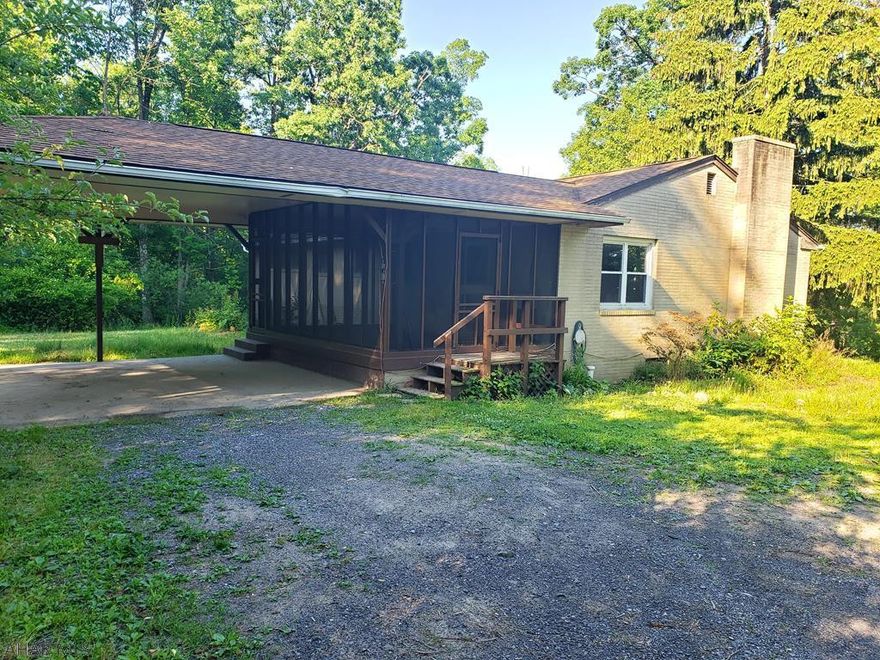 If you're looking for a home that is surrounded by woods on 2.52 acres, but yet in the middle of town and convenient to everything, THIS IS IT!  This ranch home features 3 spacious bedrooms, a large kitchen, 1.75 baths, and enough nature you could want.  There is a car port attached to the house, as well as a shed that stays.  Don't miss your chance to enjoy the nature on the large sun porch, or in the yard of this wooded oasis.  The basement is huge with tons of storage.  There is a work bench and an area that could be used as another living space.  Call Listing Agent for your personal tour today!
