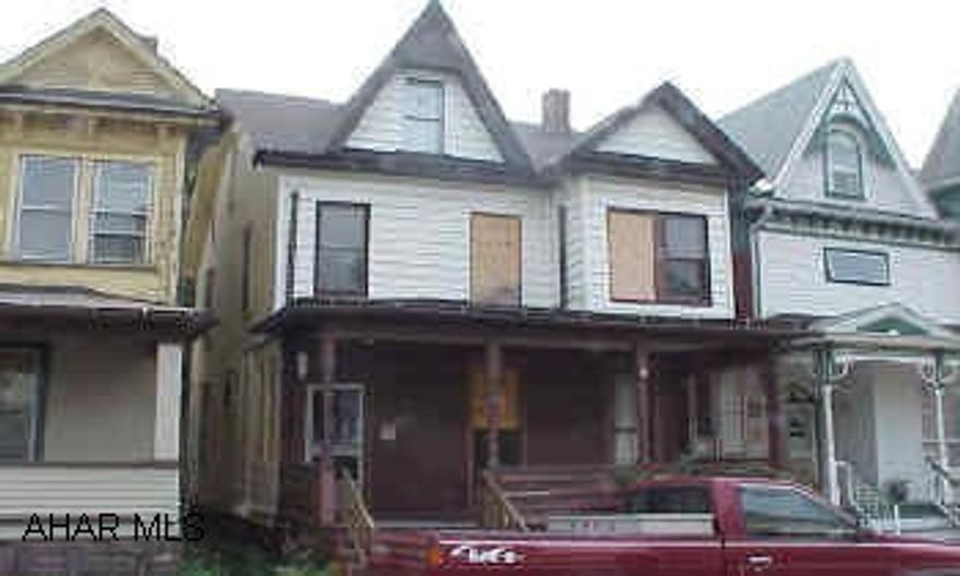 Handyman Special.  Old kitchen.  2nd floor would make nice laundry room.  Could be duplexed. $500 Bonus to selling agency if an accepted offer is received within the next 30 days.