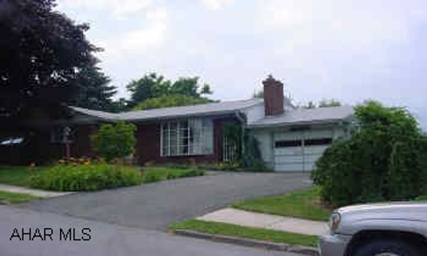 Very nice ranch home with wood oak wood floors, cedar family room(14'x20'), 2-Gas fire places,  electric backup heat, reck. room in basement, back yard coverd patio, camper parking off street, nicely landscaped, close to athelic field, residential neighborhood.