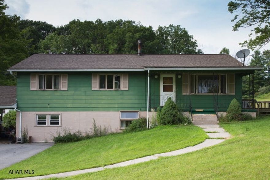 This raised ranch is in a private location with very quick access to major roadways.  The home needs some TLC but it has incredible potential.  It features a covered front porch, spacious rooms, and large windows.  Enjoy a large front and back yard as well as a spacious driveway with a carport.  From the kitchen exit door walk onto a large 26x14 deck.  This home also has a full basement that has so much potential.  Two of the basement rooms were previously used as bedrooms.